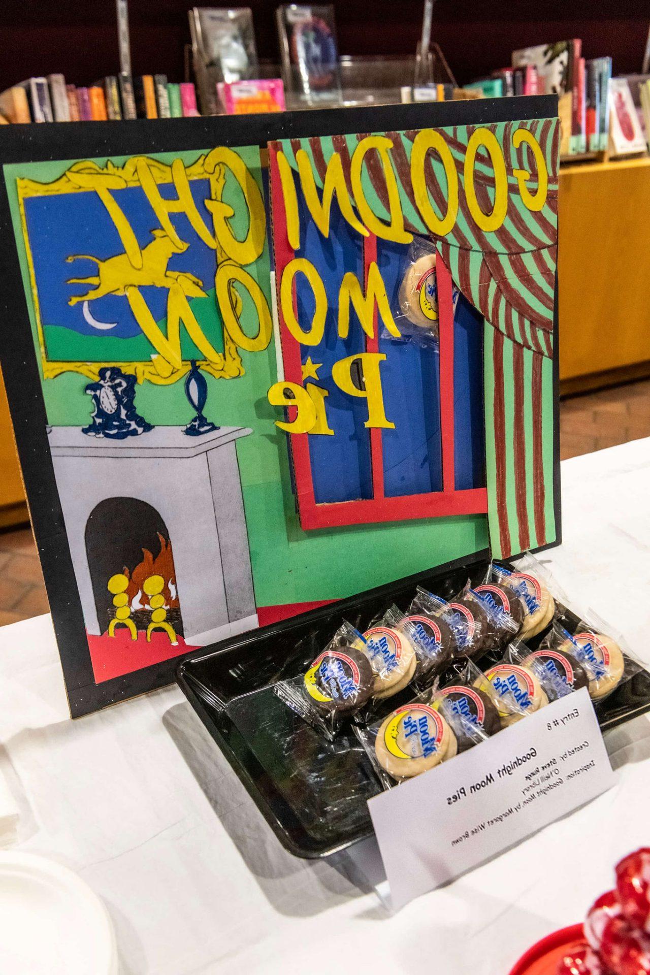 A takeoff on the cover of "Goodnight Moon," changed to "Goodnight Moon Pies" with moon pie cakes next to it